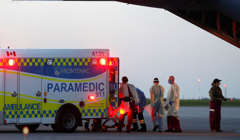 Medical personnel unload a patient from a Royal Canadian Air Force